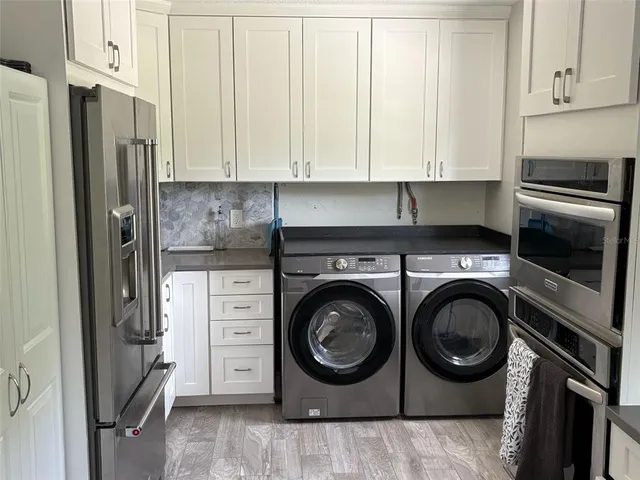 a utility room with dryer and washer