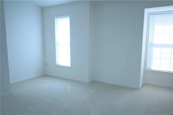 a white toilet sitting next to a bathroom sink and tub