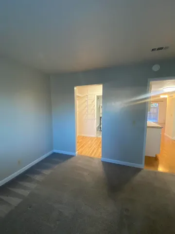 a view of an empty room with a window