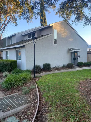 a backyard of a house with lots of green space
