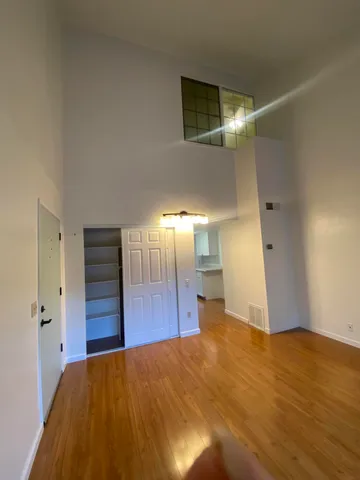a view of a livingroom with wooden floor