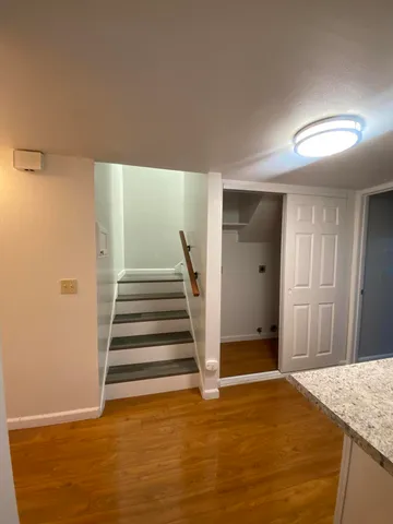 a view of entryway with wooden floor