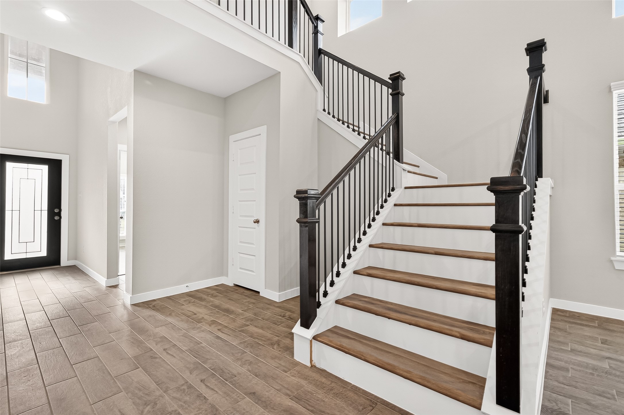 2142 Reed Cave Lane Spring, TX 77386 - Photo 15 of 50 a view of staircase with white walls and railing