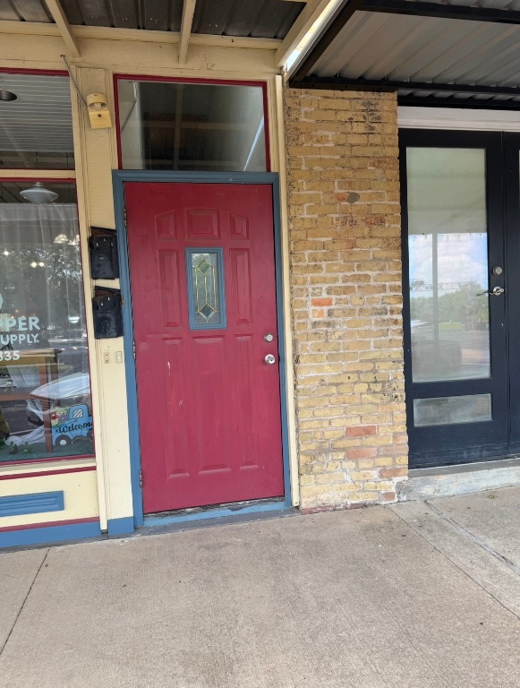 104 Depot Street, Unit B Elgin, TX 78621 - Photo 15 of 15 Doorway to property featuring brick siding