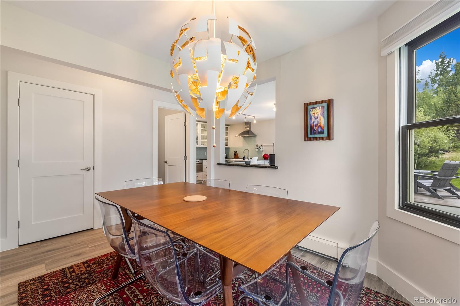 196 Wellington Road Breckenridge, CO 80424 - Photo 12 of 45 a view of a dining room with furniture and wooden floor
