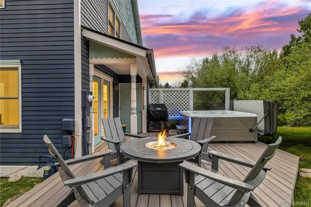 a view of a patio with a table and chairs