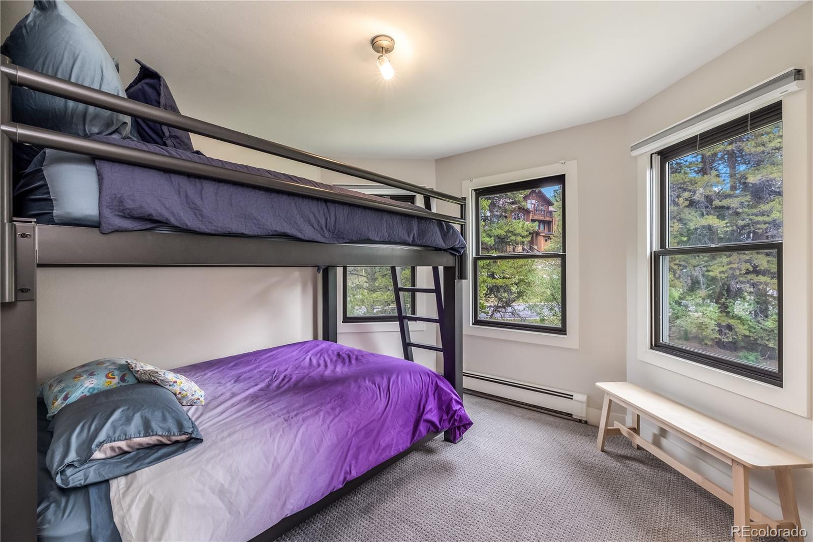 196 Wellington Road Breckenridge, CO 80424 - Photo 22 of 45 a bedroom with a bed and window