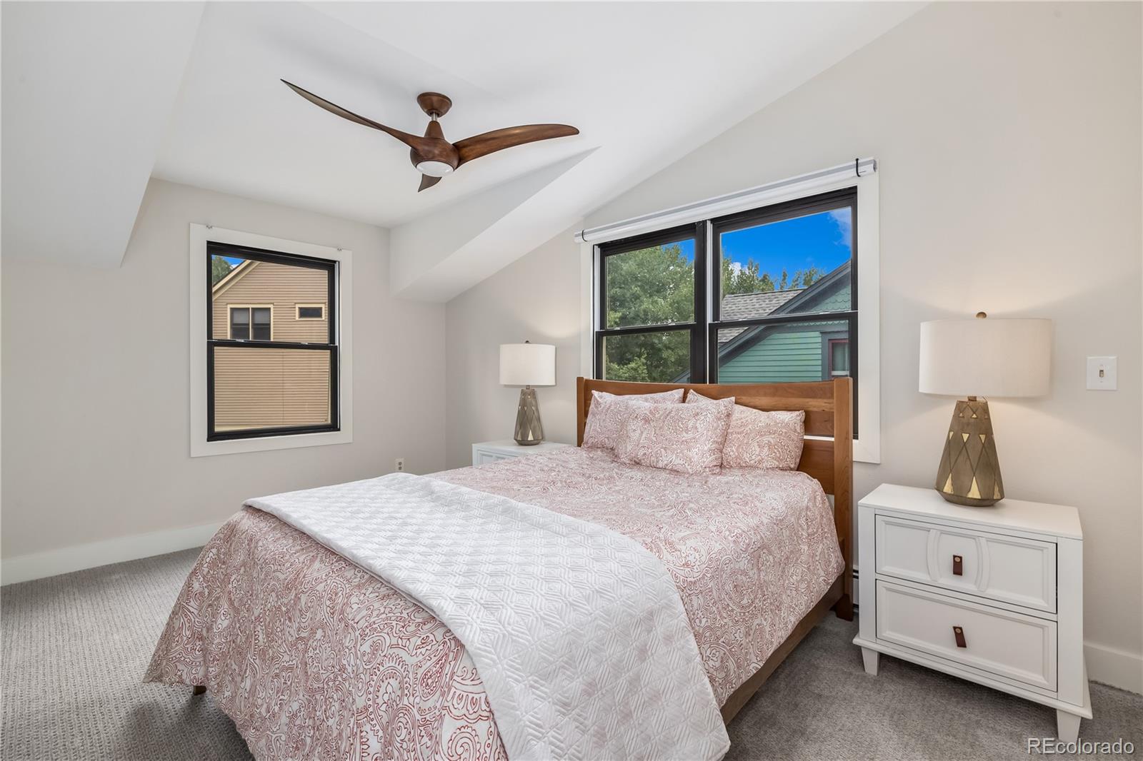 196 Wellington Road Breckenridge, CO 80424 - Photo 24 of 45 a bedroom with a large bed and a window