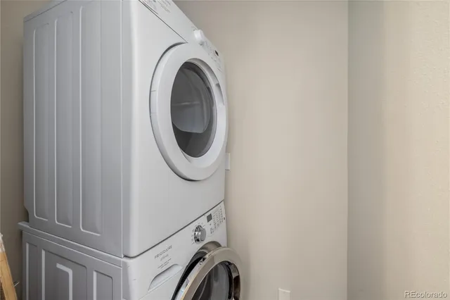 a view of a house with a yard and a forest