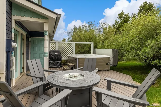 a view of a backyard with sitting area
