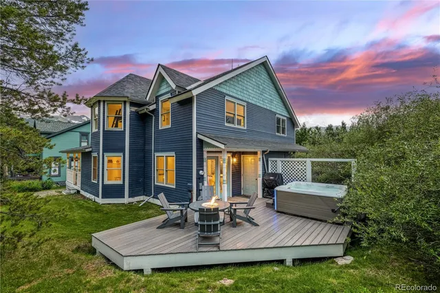 a view of a city with lush green forest