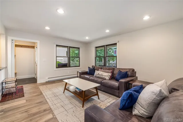a living room with furniture and a window