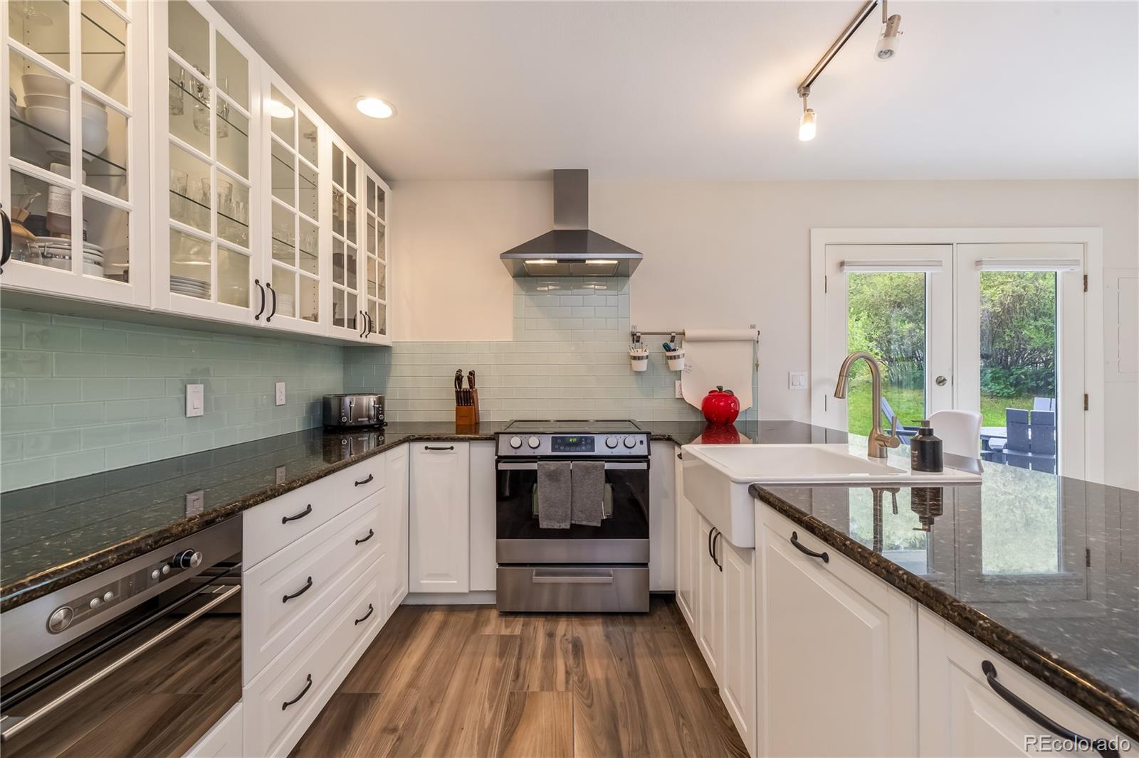 196 Wellington Road Breckenridge, CO 80424 - Photo 8 of 45 a kitchen with stainless steel appliances granite countertop a stove and a sink