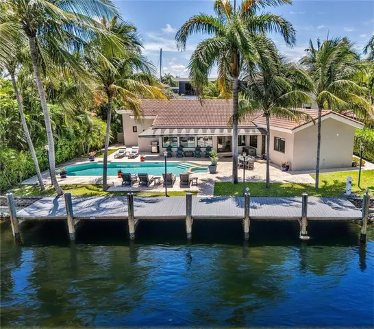 a view of a livingroom with furniture and a flat screen tv