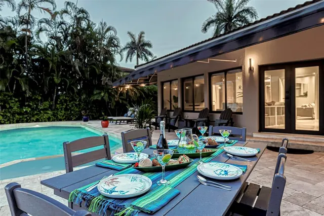 a living room with furniture and flat screen tv