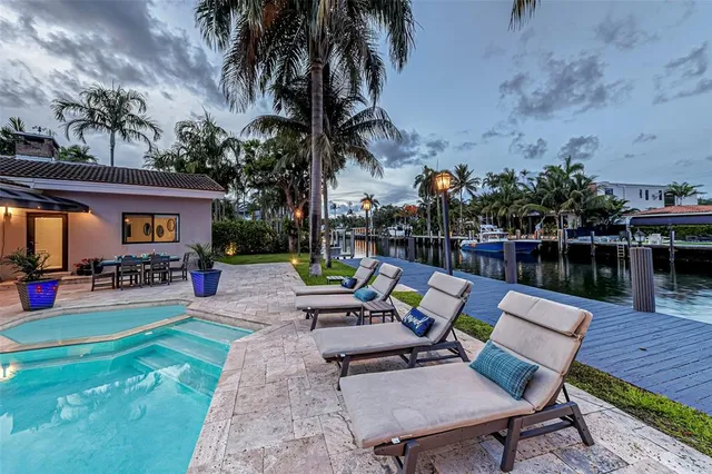 a kitchen with lots of counter top space and furniture