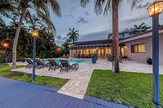 a kitchen with a sink stainless steel appliances and cabinets