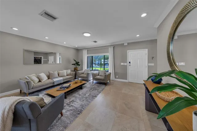 a bedroom with bed couch and window