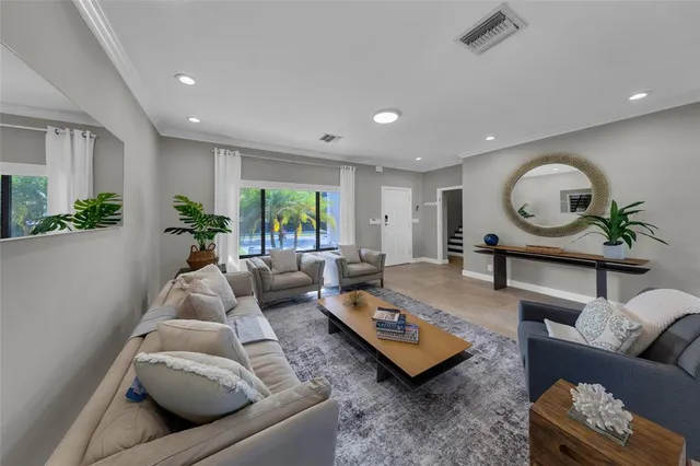 a bedroom with furniture and a flat screen tv