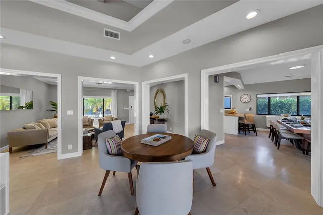 a bedroom with a bed and a large mirror