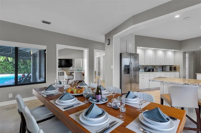 a spacious bathroom with a tub sink and mirror