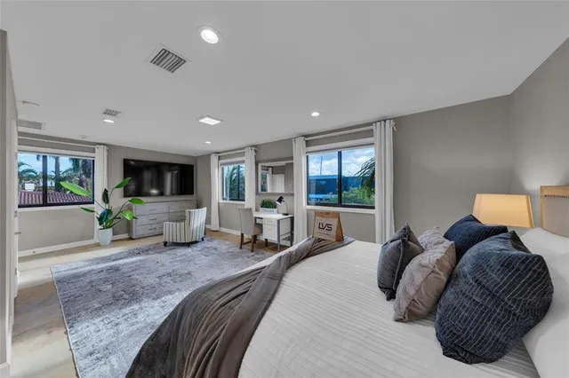 a view of backyard with table and chairs
