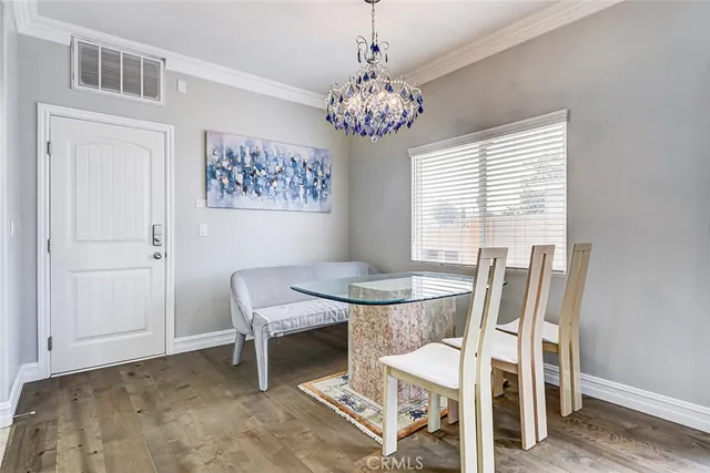 a view of a dining room with furniture and window