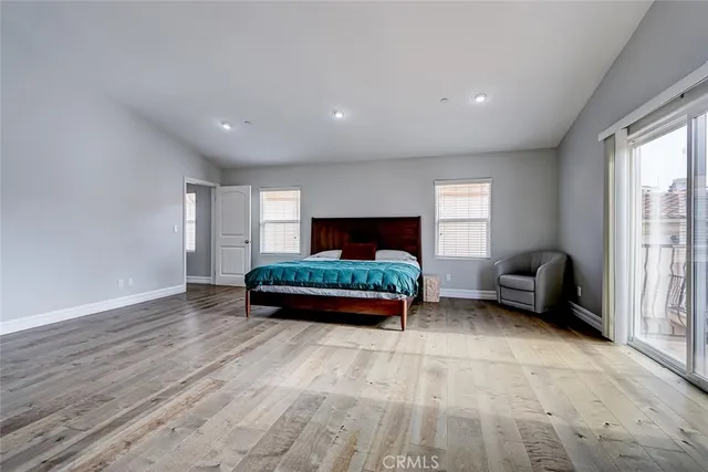 a bedroom with furniture and a window