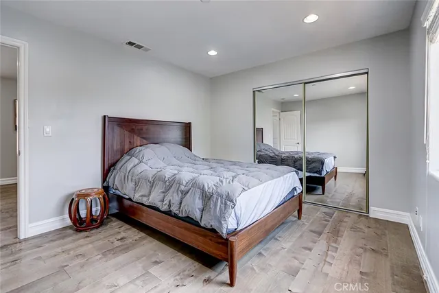 a bedroom with a bed and a table