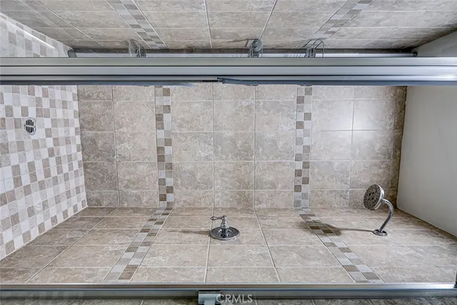 a bathroom with a granite countertop a sink and a mirror