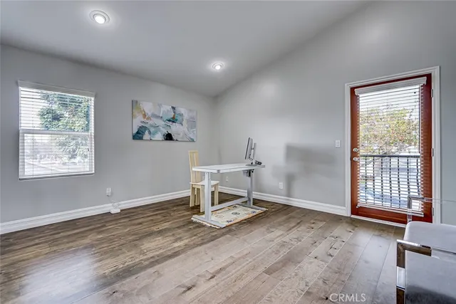 a living room with hard wood floors