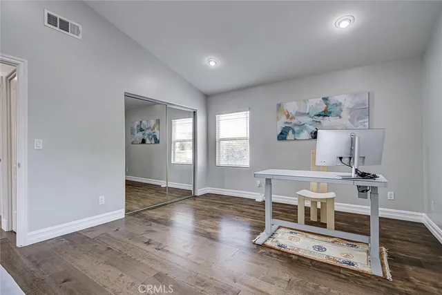 a view of livingroom with furniture wooden floor and front door