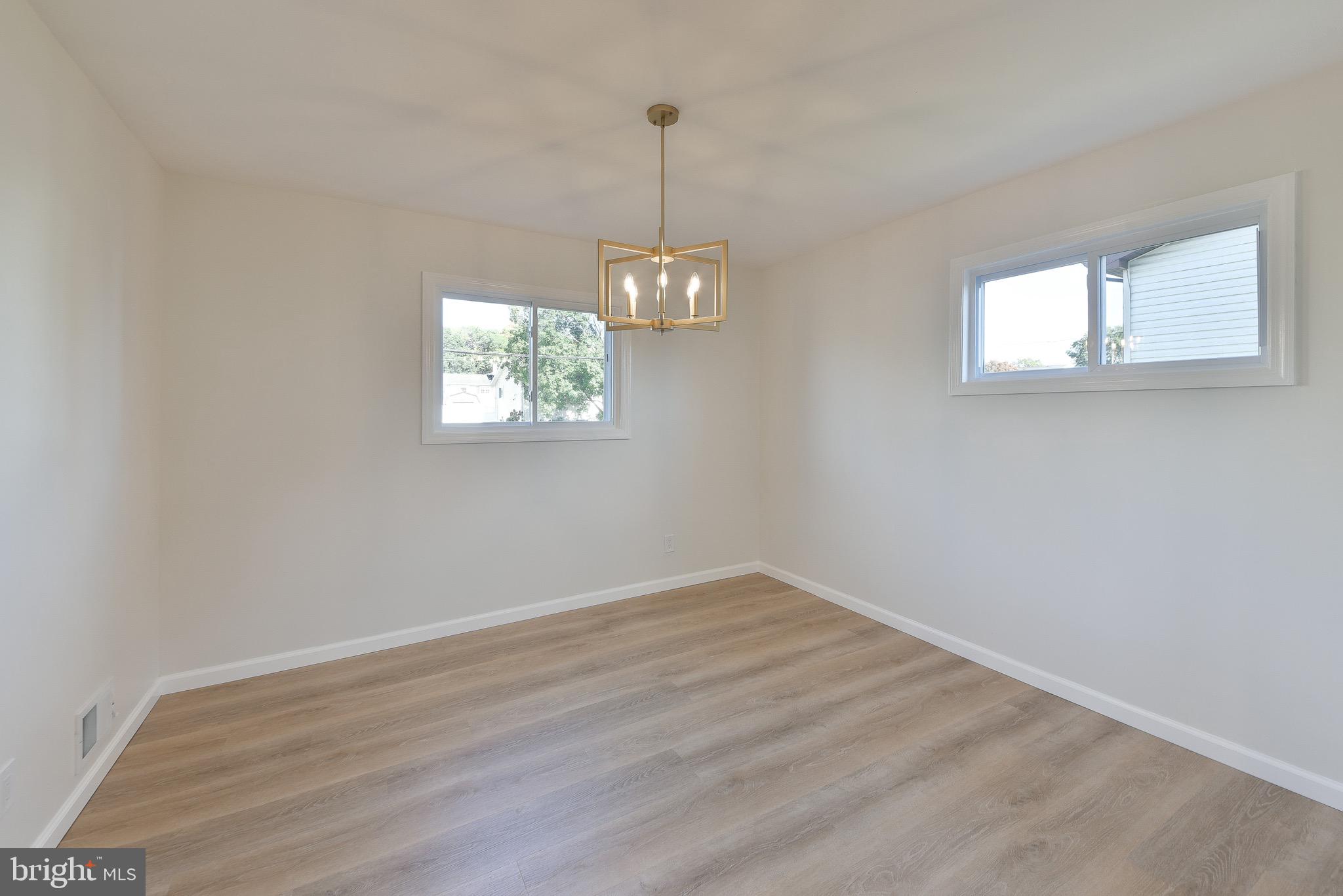 13 Sycamore Way Hamilton, NJ 08690 - Photo 16 of 37 an empty room with wooden floor and windows