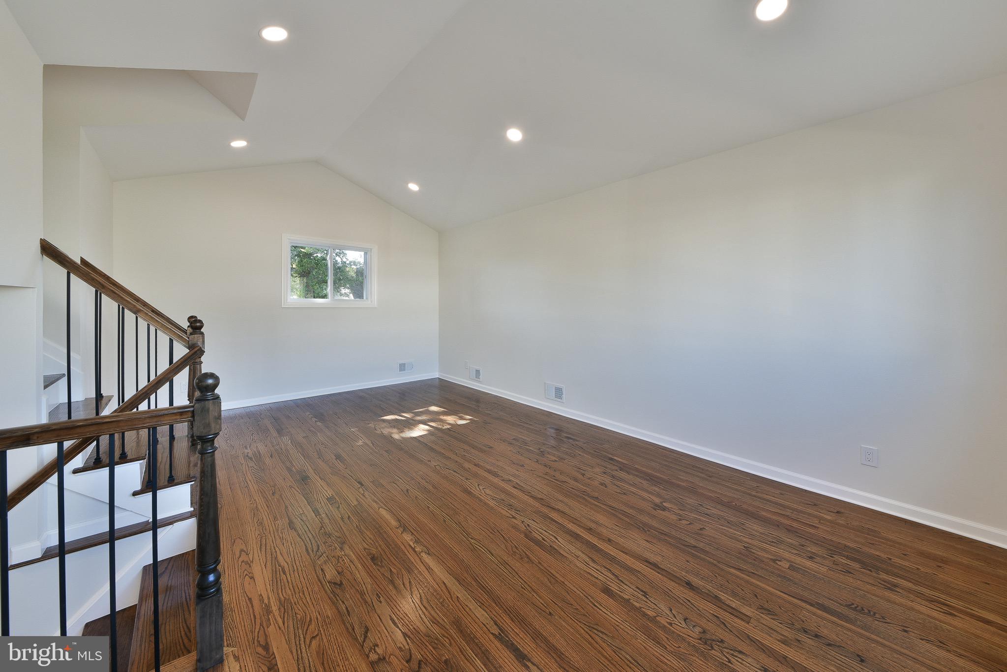 13 Sycamore Way Hamilton, NJ 08690 - Photo 18 of 37 a view of a livingroom with wooden floor and staircase