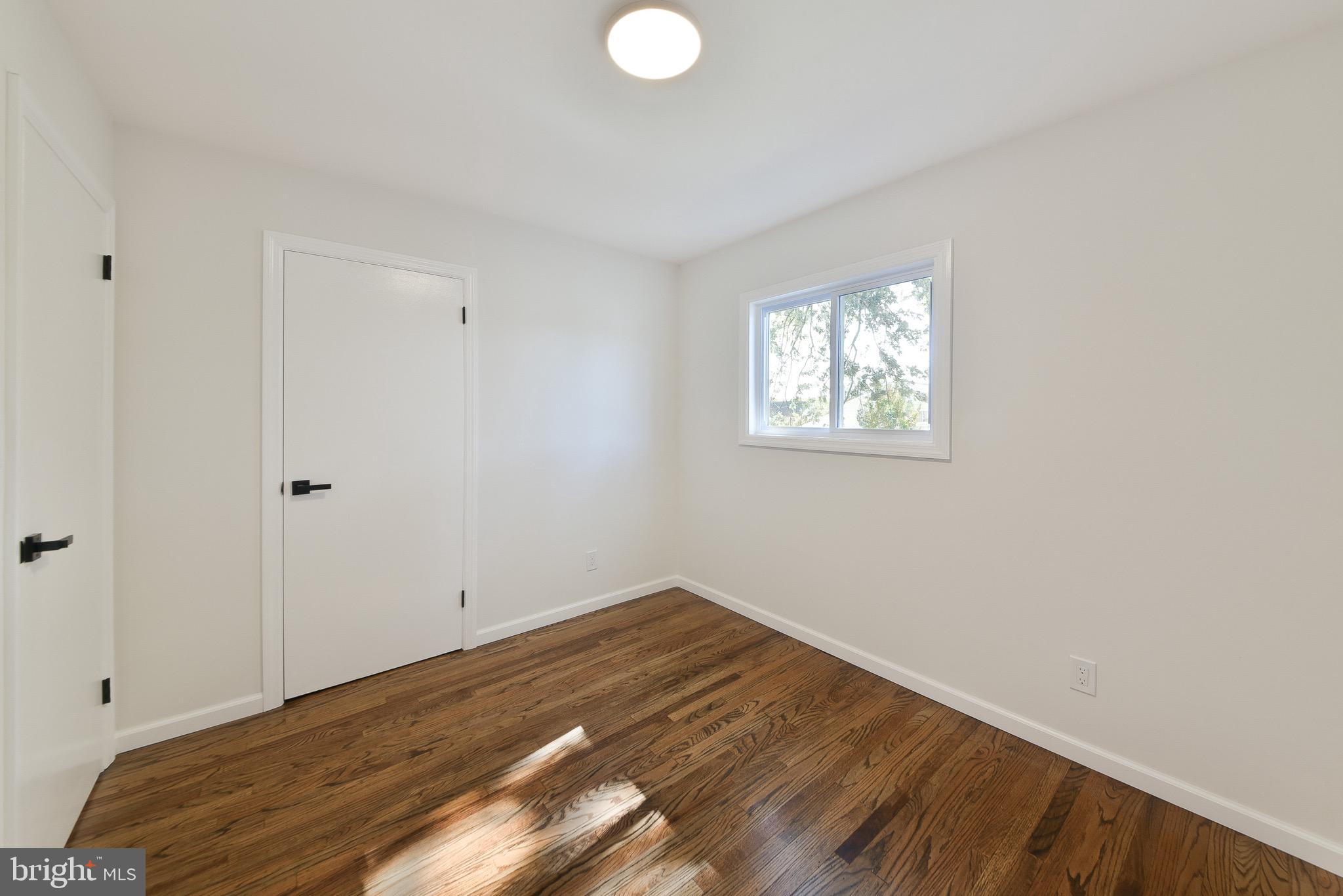 13 Sycamore Way Hamilton, NJ 08690 - Photo 21 of 37 an empty room with wooden floor and windows