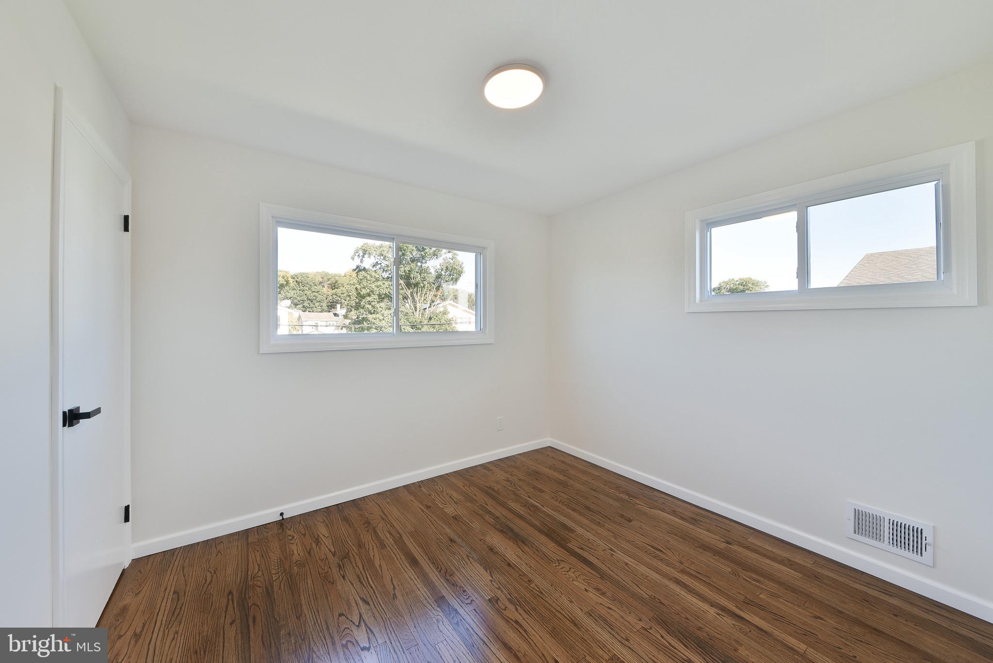13 Sycamore Way Hamilton, NJ 08690 - Photo 25 of 37 a view of empty room with wooden floor and fan