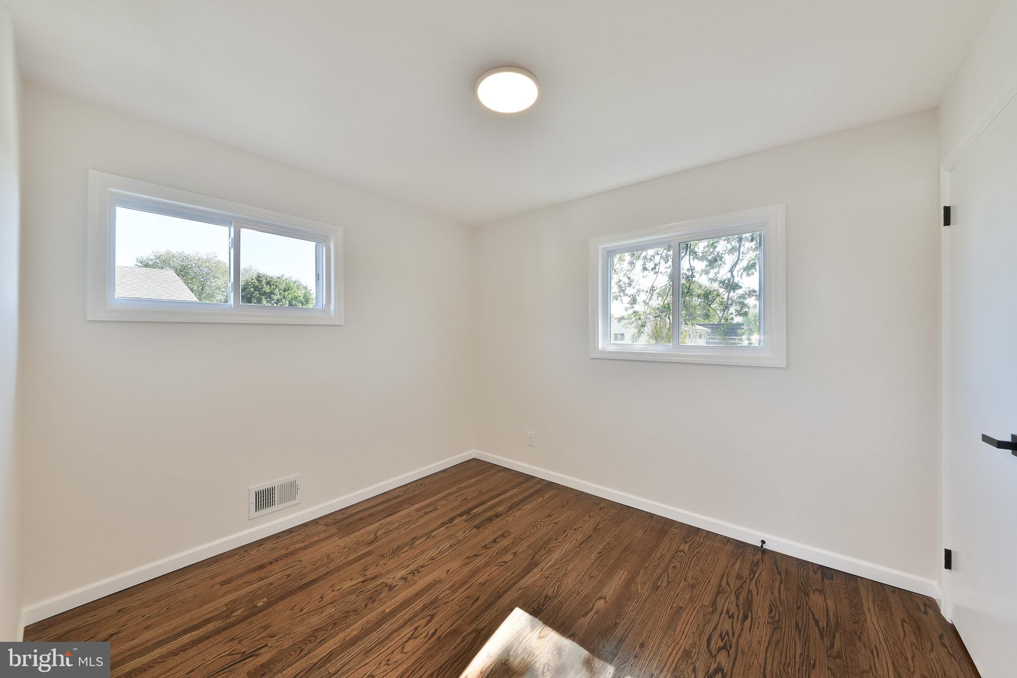13 Sycamore Way Hamilton, NJ 08690 - Photo 27 of 37 a view of empty room with wooden floor