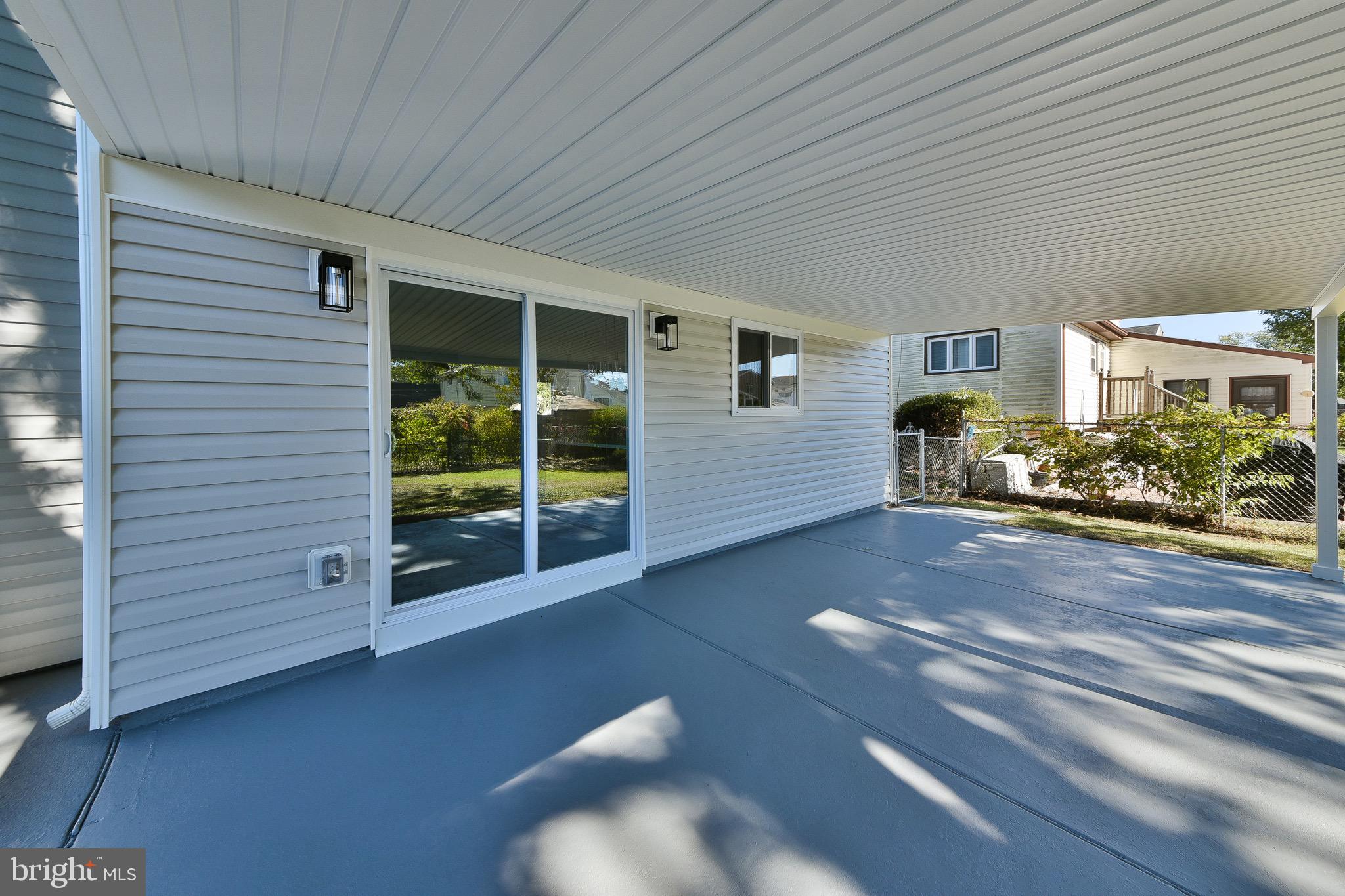 13 Sycamore Way Hamilton, NJ 08690 - Photo 35 of 37 a view of a porch with furniture and a yard
