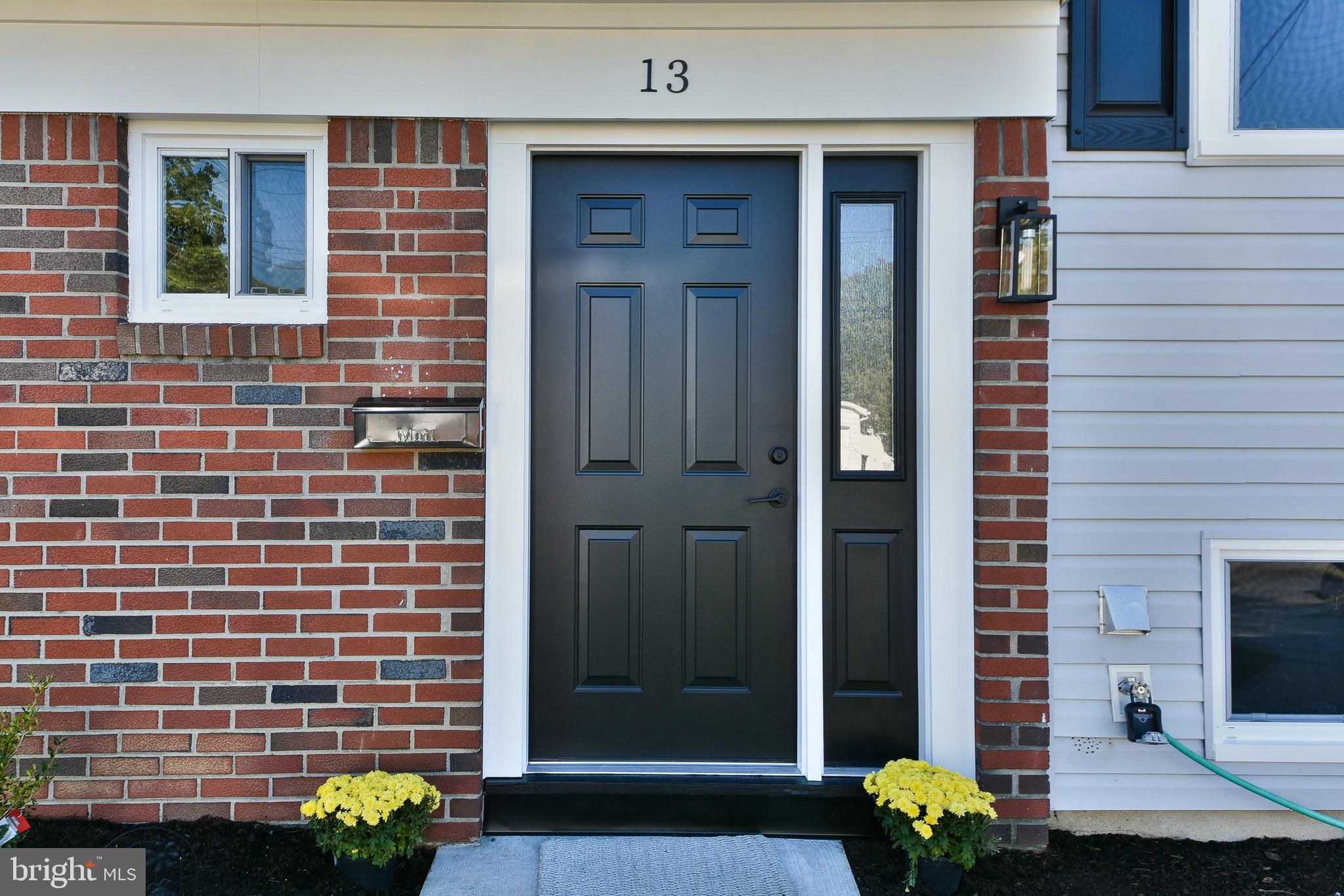 13 Sycamore Way Hamilton, NJ 08690 - Photo 4 of 37 a front view of a house with a garden