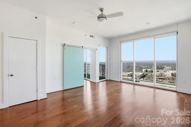 a bedroom with a bed and a potted plant