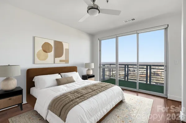 a bedroom with a bed and a potted plant