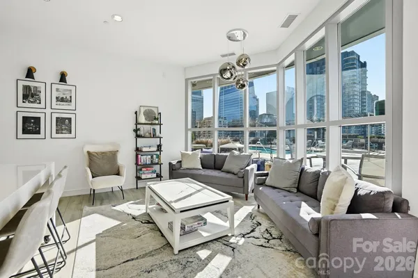 a outdoor space with lots of furniture and white walls