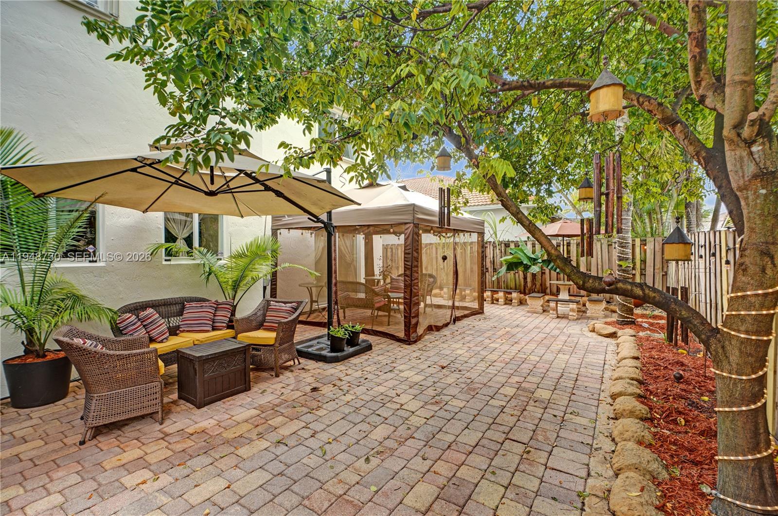 5502 Southwest 162nd Place Miami, FL 33185 - Photo 7 of 72 a view of a backyard with sitting area and furniture