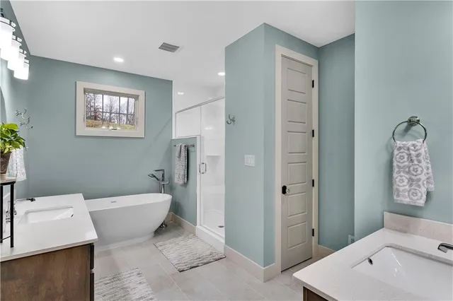 a bathroom with a toilet sink and shower