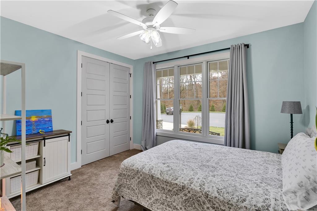 1316 South S Valley Export, PA 15632 - Photo 24 of 42 a bedroom with a bed and a flat tv screen on dresser