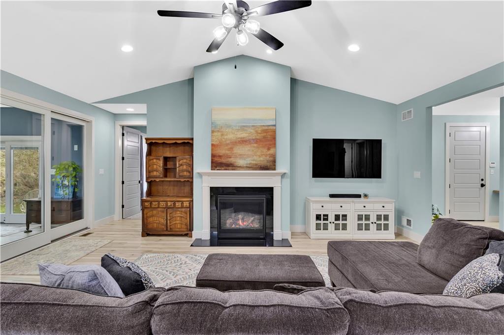1316 South S Valley Export, PA 15632 - Photo 7 of 42 a living room with furniture a flat screen tv and a fireplace