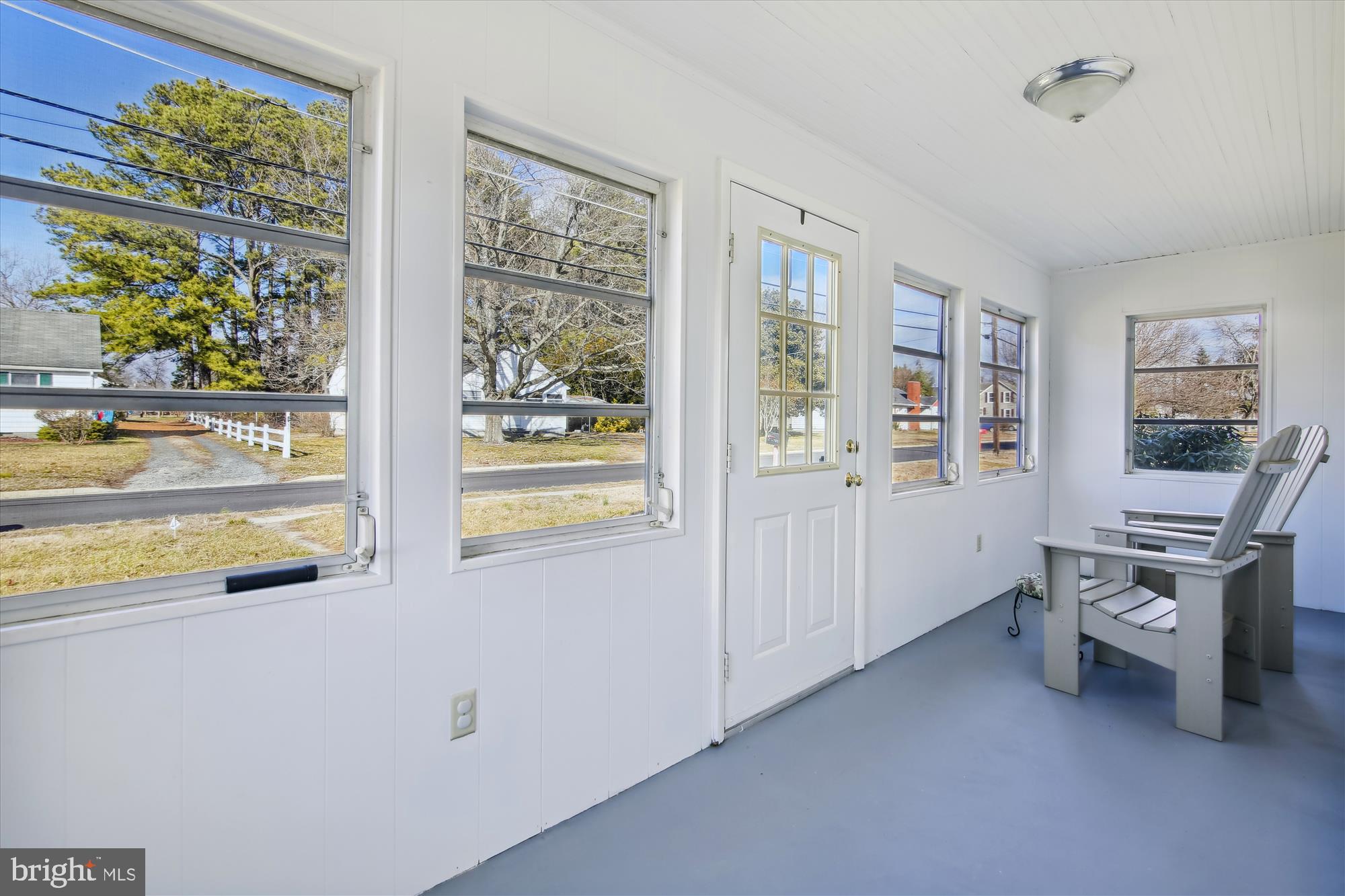 702 Camp Road Denton, MD 21629 - Photo 5 of 52 Bright & Sunny enclosed porch.