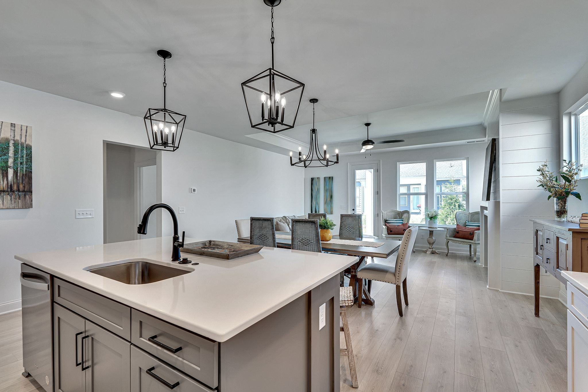 6826 Chatsworth Court Murfreesboro, TN 37129 - Photo 15 of 32 a kitchen with stainless steel appliances a table chairs and white cabinets
