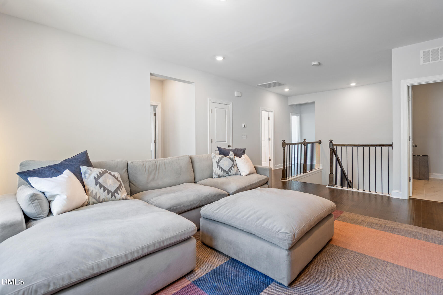 2966 Rise And Shine Road Apex, NC 27502 - Photo 26 of 61 a living room with furniture and a wooden floor