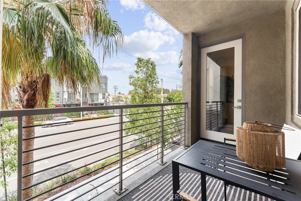134 Citysquare Irvine, CA 92614 - Photo 18 of 32 a view of balcony and floor with wooden floor and fence